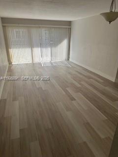 8741 Wiles Road, Unit 208 Coral Springs, FL 33067 - Photo 10 of 11 a view of an empty room with a window