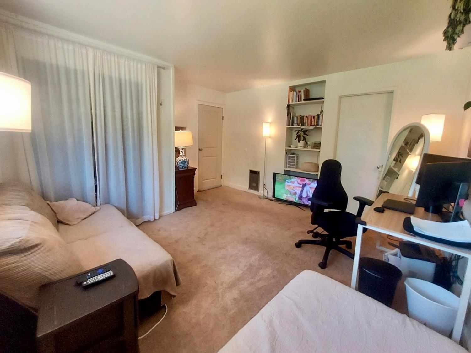 6880 Kahala Road Garden Valley, CA 95633 - Photo 12 of 52 a bedroom with a bed and a flat screen tv