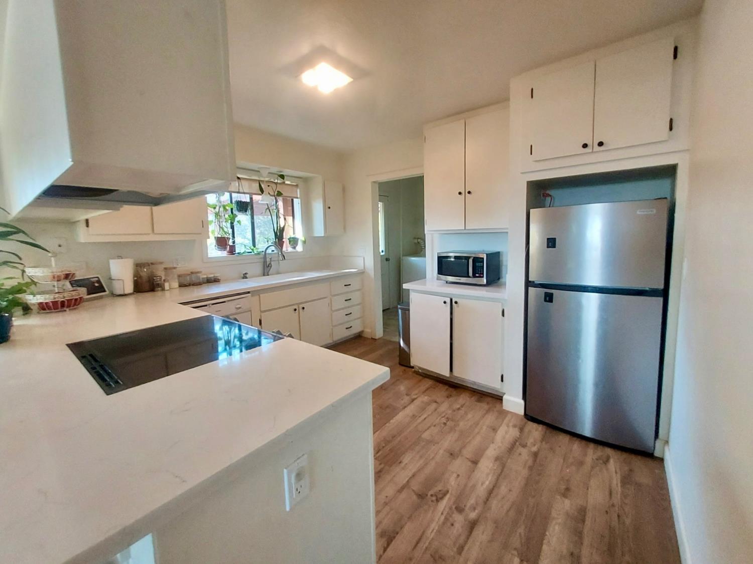 6880 Kahala Road Garden Valley, CA 95633 - Photo 3 of 52 a kitchen with stainless steel appliances a refrigerator sink and cabinets