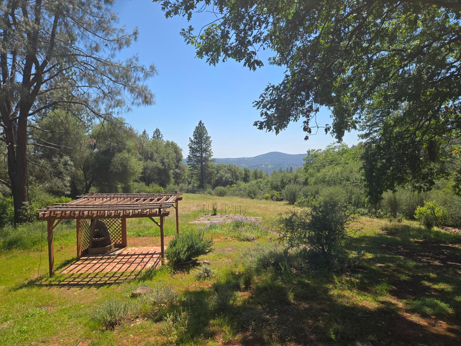 6880 Kahala Road Garden Valley, CA 95633 - Photo 48 of 52 a view of a lake with a yard