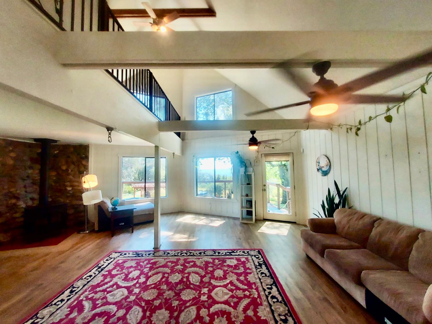 6880 Kahala Road Garden Valley, CA 95633 - Photo 5 of 52 a living room with furniture and a rug