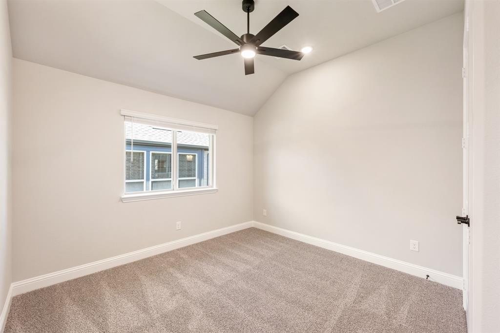 14426 McClint Street Pilot Point, TX 76258 - Photo 26 of 34 an empty room with a window and a fan