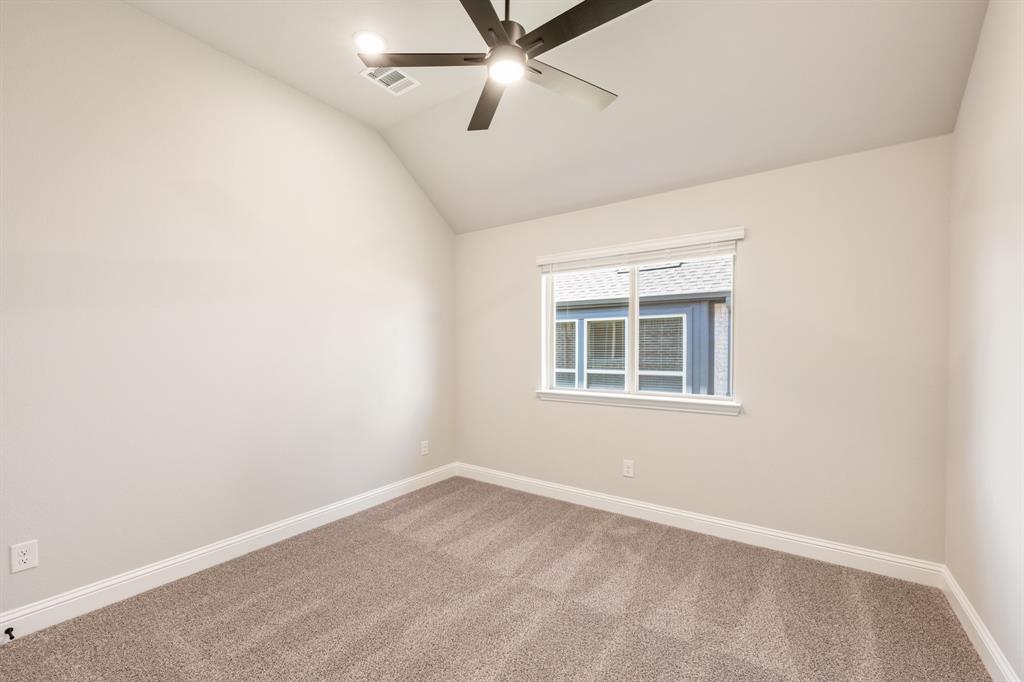 14426 McClint Street Pilot Point, TX 76258 - Photo 28 of 34 an empty room with a window and ceiling fan