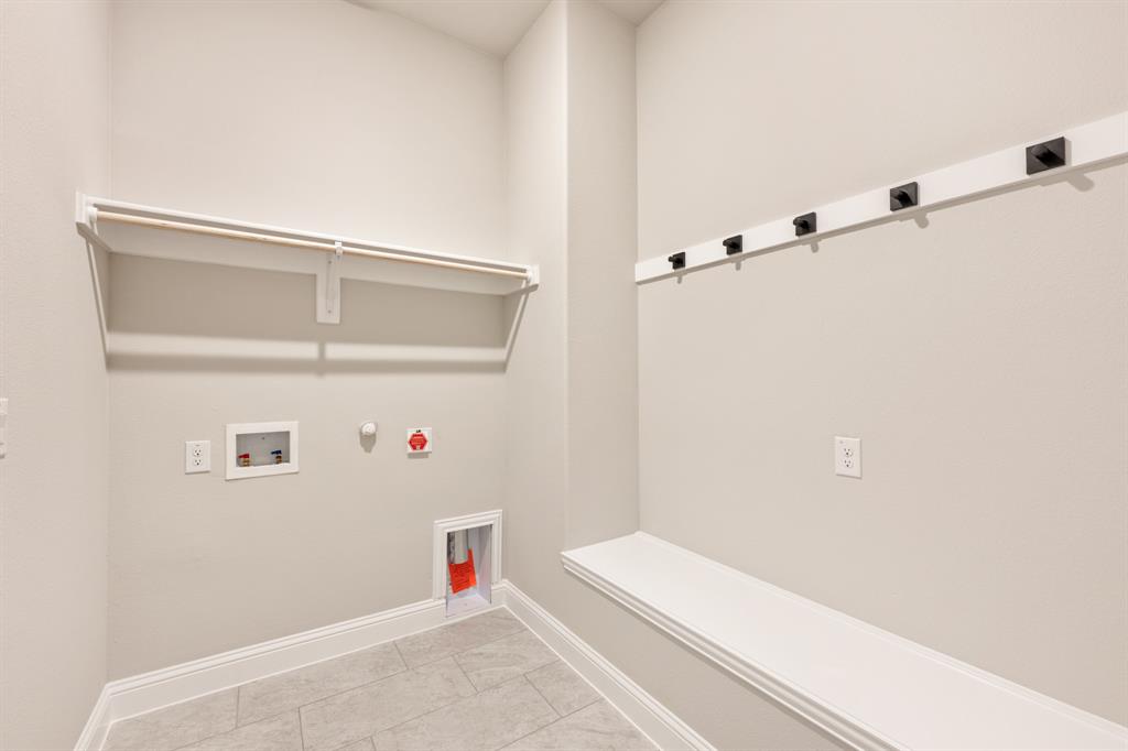 14426 McClint Street Pilot Point, TX 76258 - Photo 30 of 34 a bathroom with a bathtub and shower