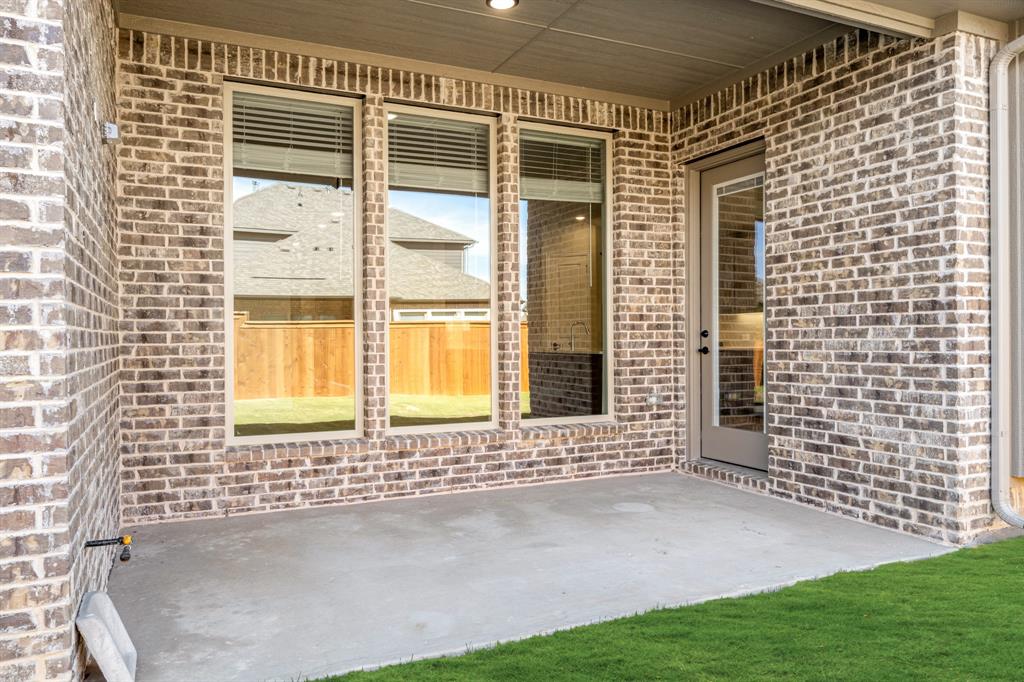 14426 McClint Street Pilot Point, TX 76258 - Photo 31 of 34 a view of a door with a door