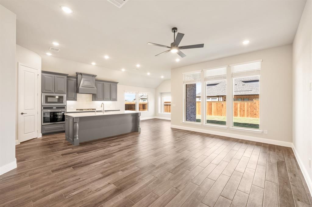14426 McClint Street Pilot Point, TX 76258 - Photo 8 of 34 a view of kitchen with cabinets and wooden floor