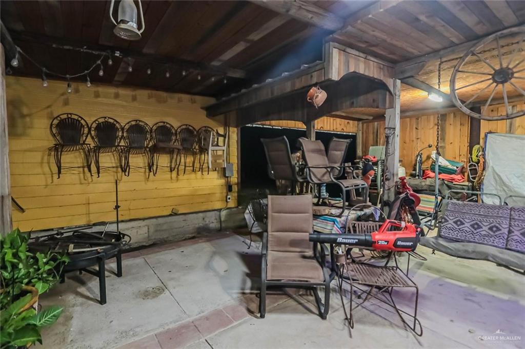 4701 Russell Circle Mission, TX 78574 - Photo 32 of 37 a view of a porch with a table and chairs