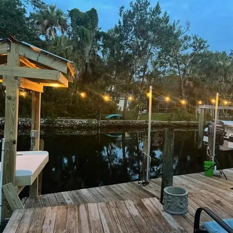 a wooden bench sitting next to a lake