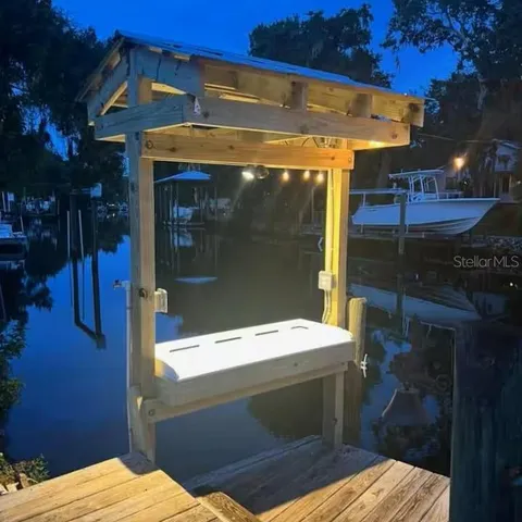 a living room with furniture and a ceiling fan