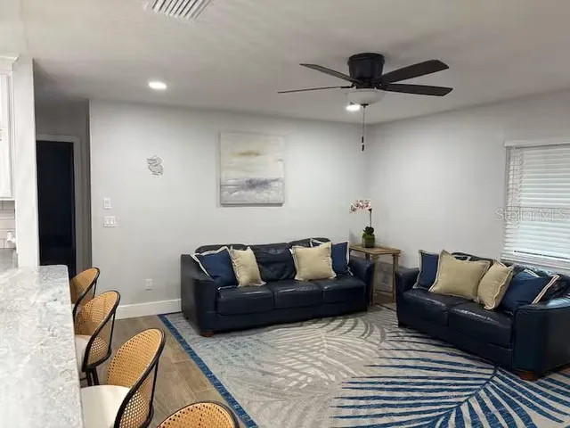 a bedroom with double bed and a chandelier