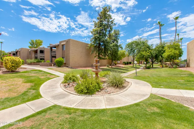 a swimming pool with outdoor seating and yard