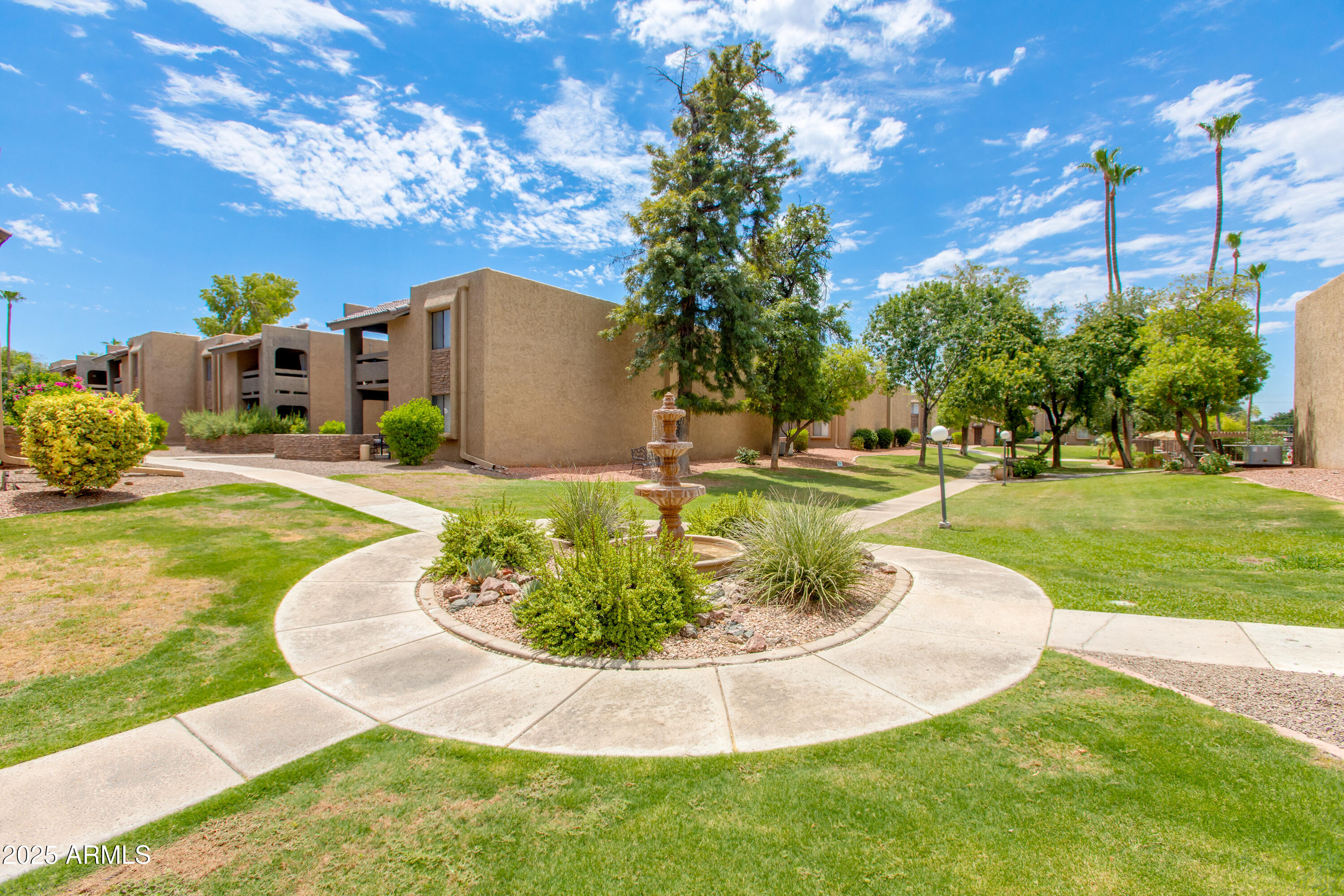 3825 East Camelback Road, Unit 105 Phoenix, AZ 85018 - Photo 13 of 14 a swimming pool with outdoor seating and yard