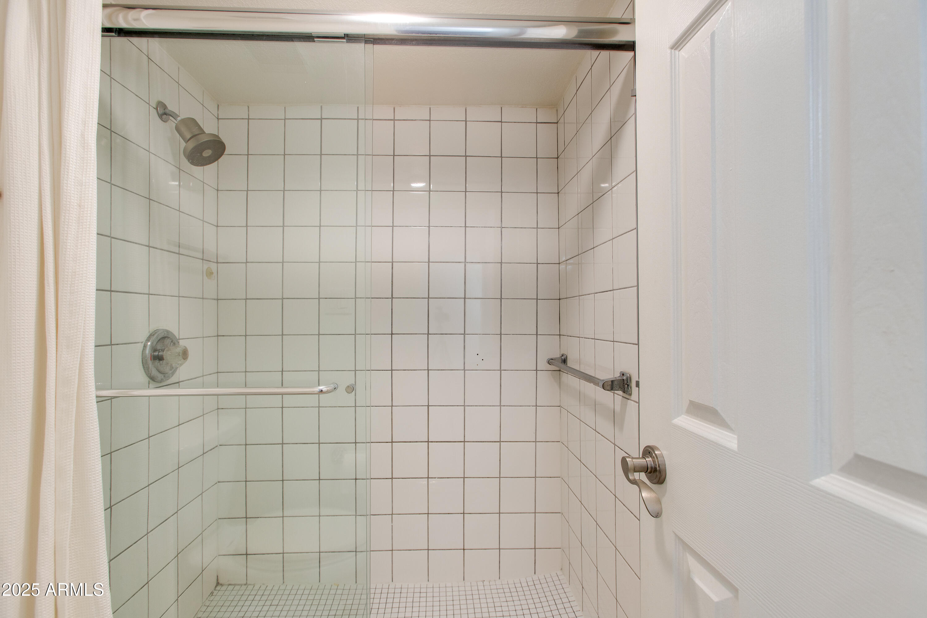 3825 East Camelback Road, Unit 105 Phoenix, AZ 85018 - Photo 9 of 14 a bathroom with a shower