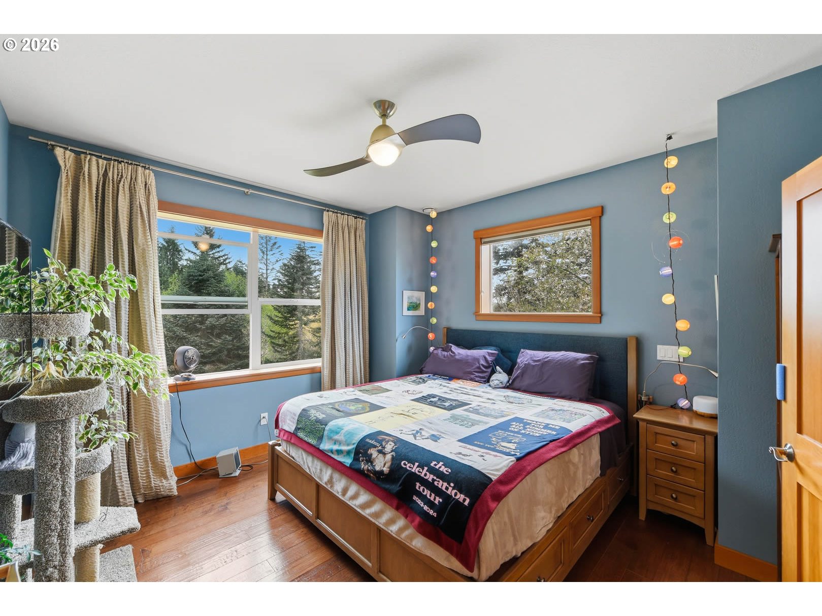 62736 Olive Barber Road Coos Bay, OR 97420 - Photo 19 of 25 a bed sitting in a bedroom next to a window
