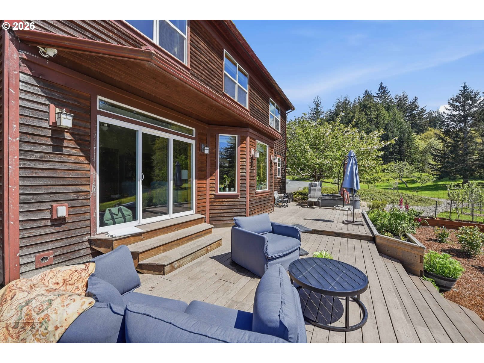 62736 Olive Barber Road Coos Bay, OR 97420 - Photo 5 of 25 a view of a house with backyard and sitting area
