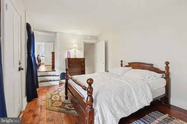 a bed room with a bed and a television