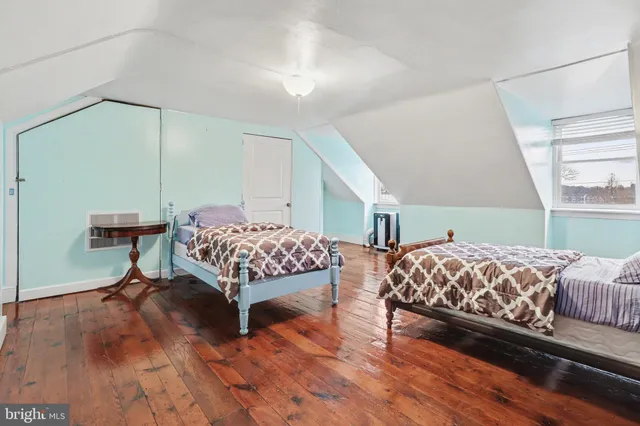 a bedroom with bed and a window