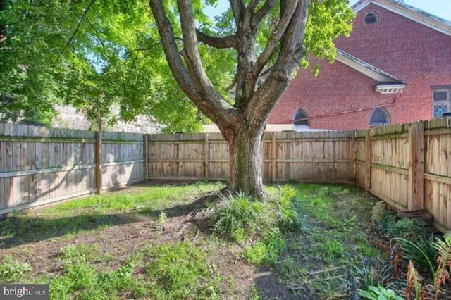 a garden with wooden fence