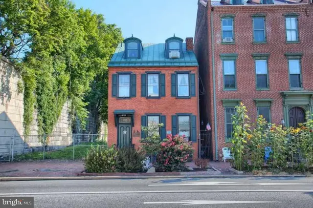 a front view of a multi story residential apartment buildings
