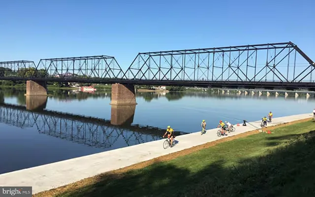 a view of a street with iron fence