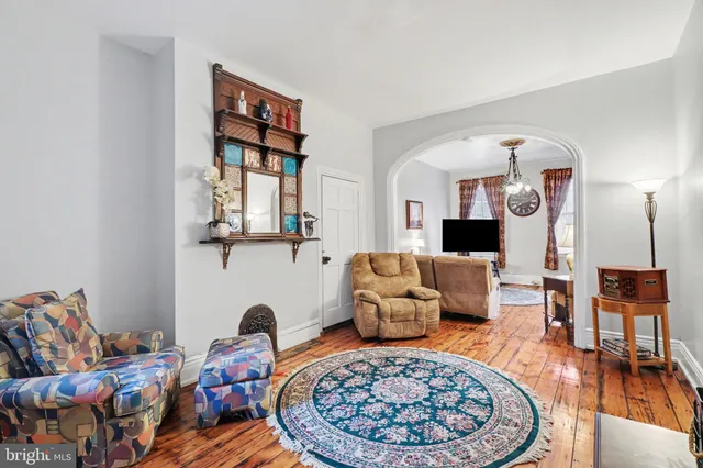 a living room with furniture and a rug