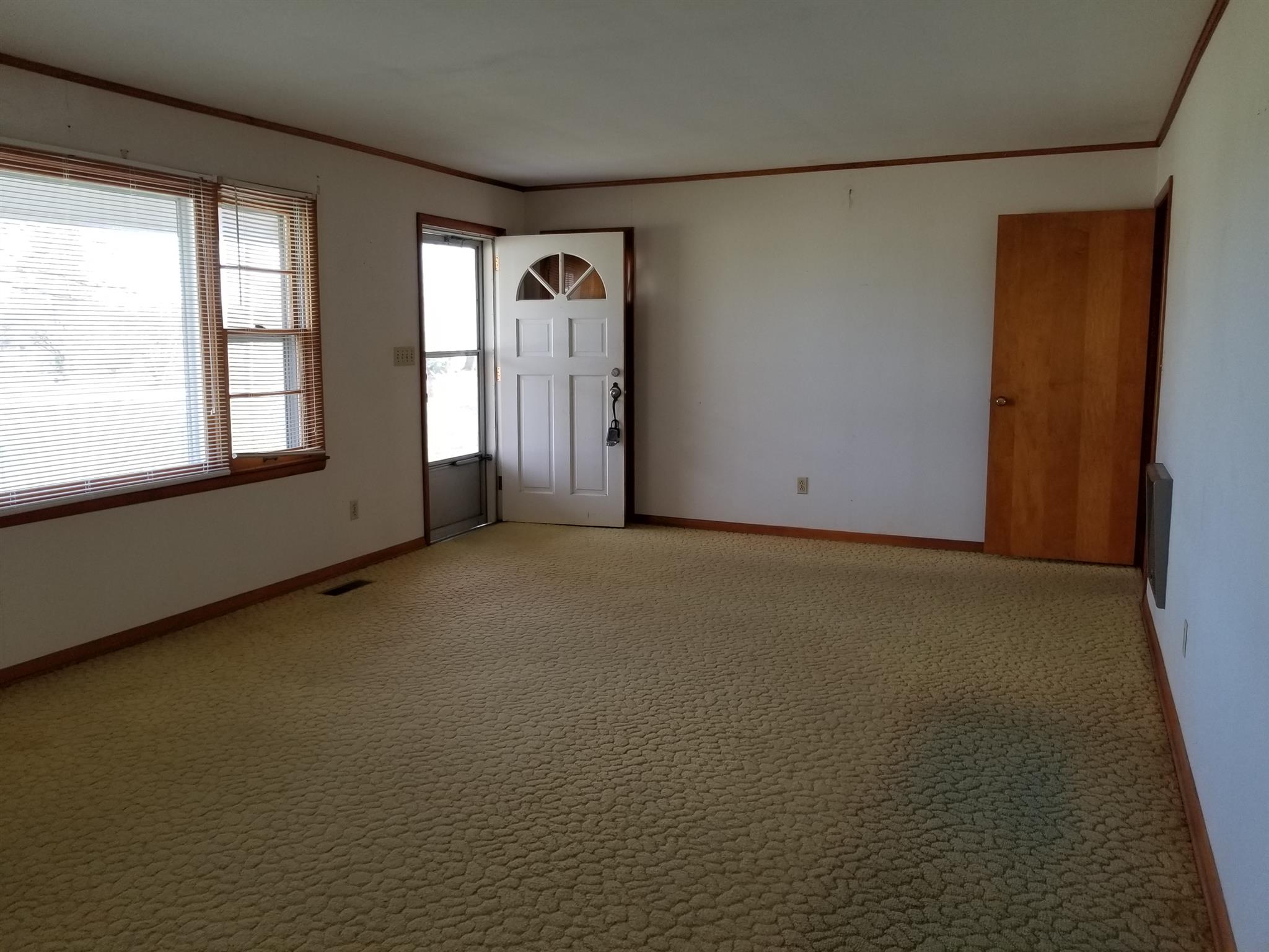 1309 Smith Road Manchester, TN 37355 - Photo 2 of 18 an empty room with windows