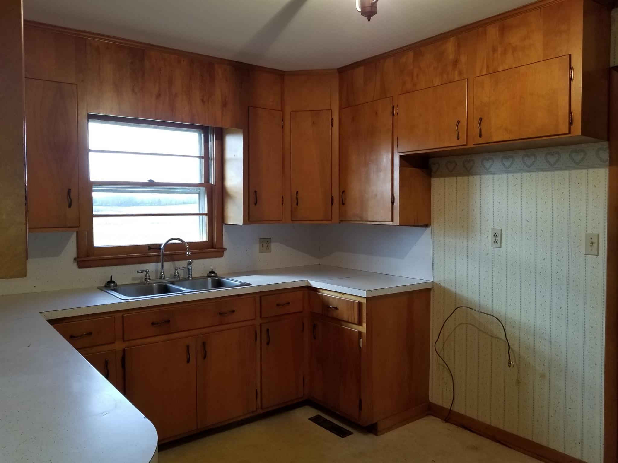 1309 Smith Road Manchester, TN 37355 - Photo 4 of 18 a kitchen with a sink cabinets and window