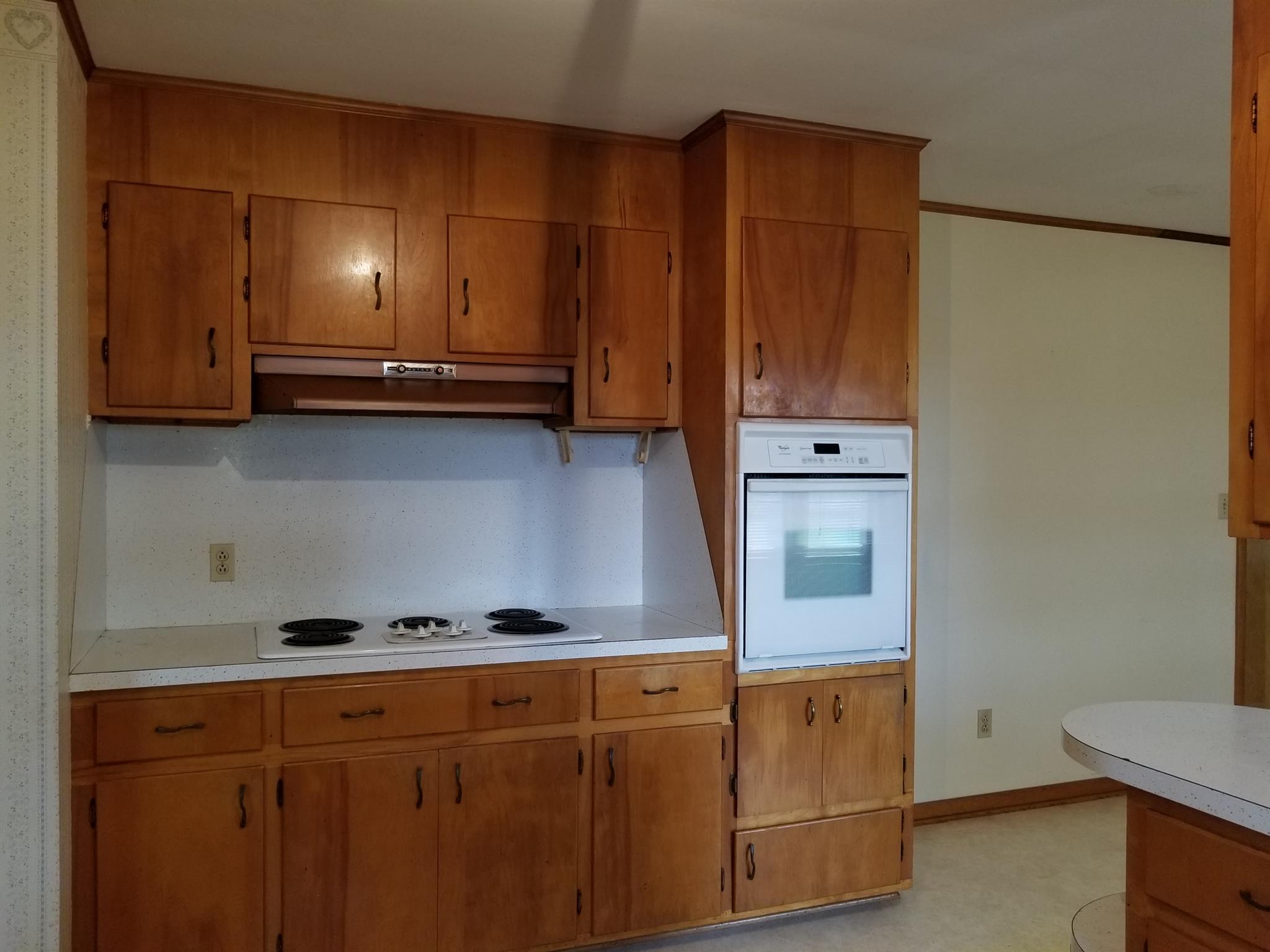 1309 Smith Road Manchester, TN 37355 - Photo 5 of 18 a view of cabinets a sink and a stove in a kitchen