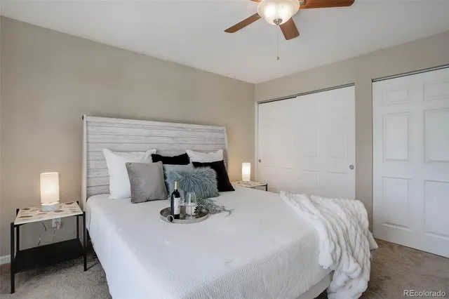 a bedroom with bed and a chandelier