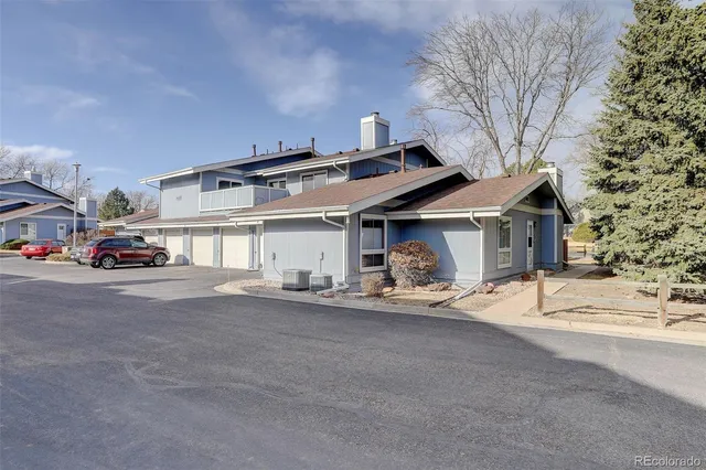 a view of a car park in front of house
