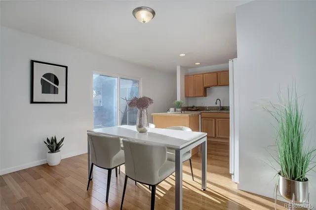 a kitchen with a table and chairs in it