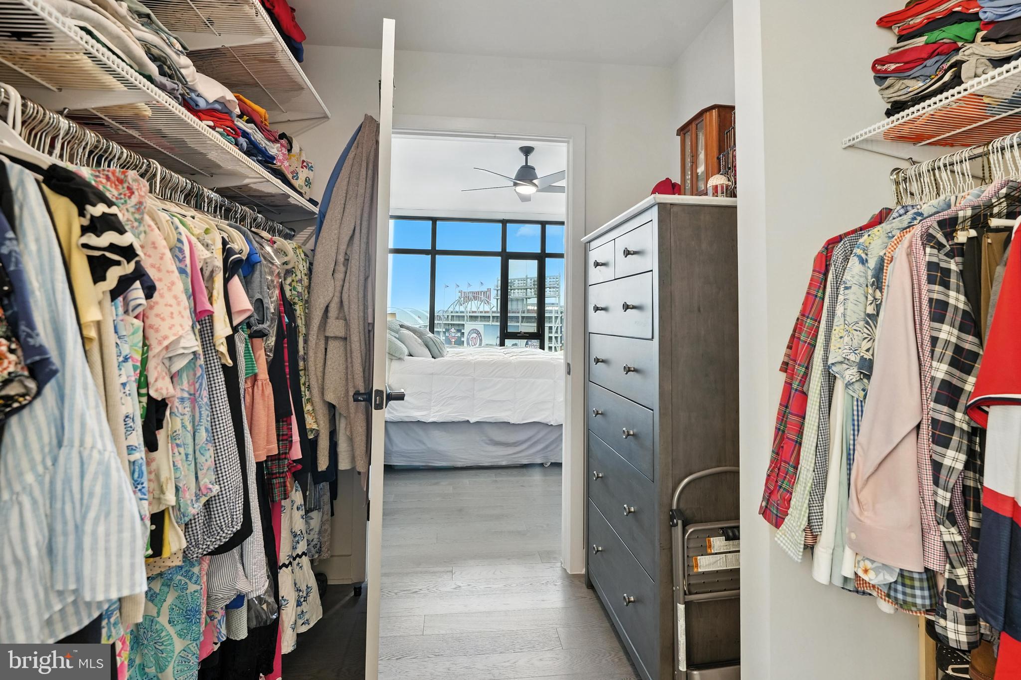 70 N Street Southeast, Unit N913 Washington, DC 20003 - Photo 15 of 77 a view of walk in closet with clothes and shoes