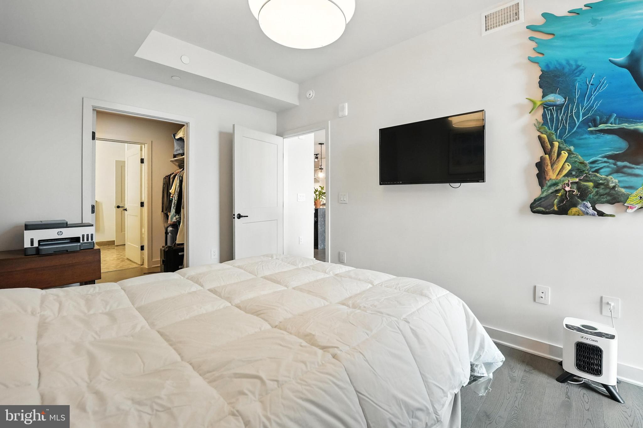 70 N Street Southeast, Unit N913 Washington, DC 20003 - Photo 18 of 77 a bedroom with a bed and a flat screen tv