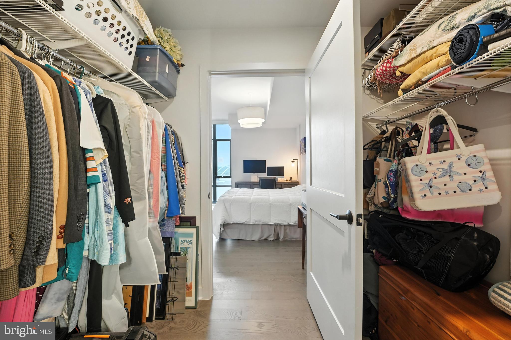 70 N Street Southeast, Unit N913 Washington, DC 20003 - Photo 19 of 77 a view of walk in closet with clothes and shoes