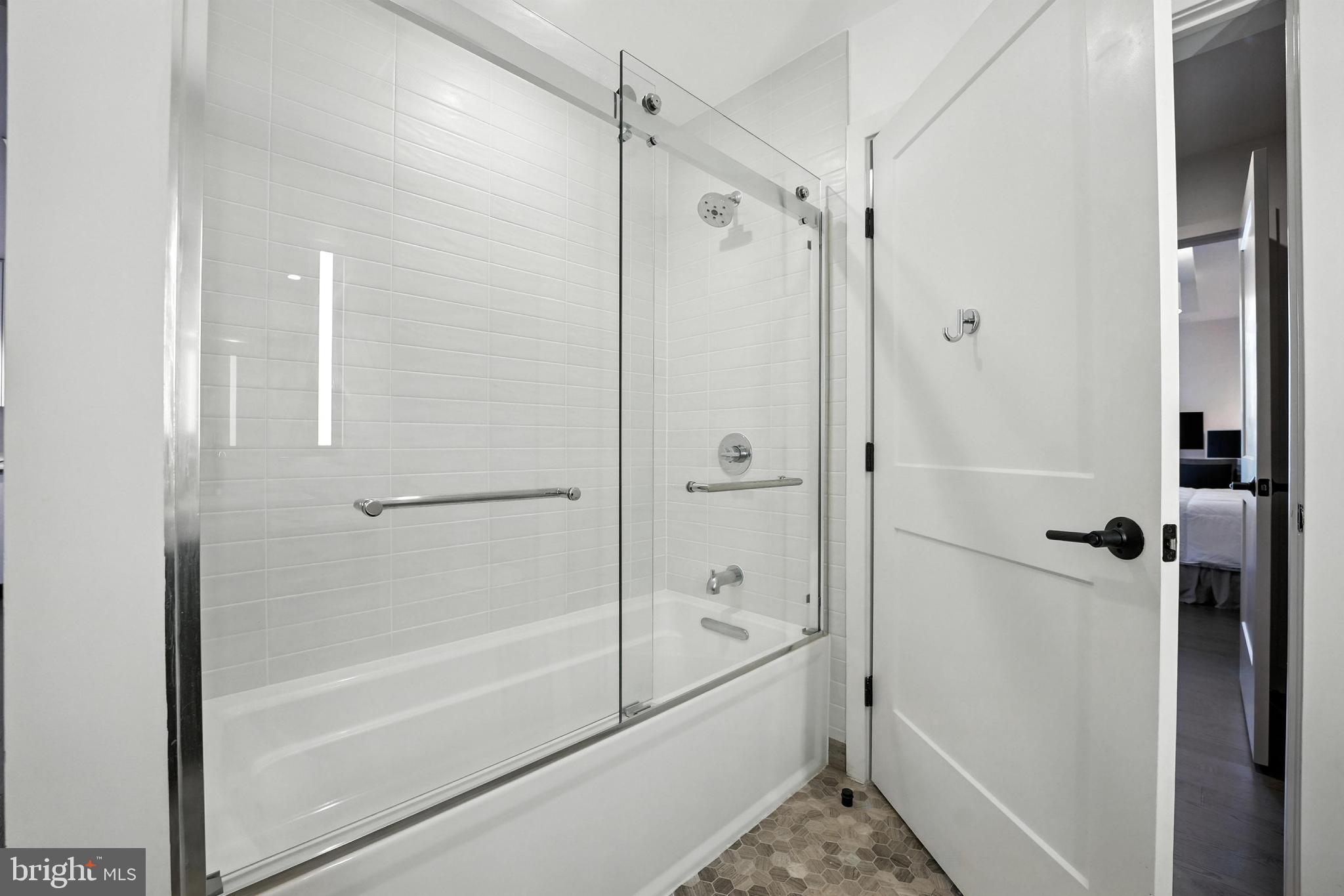 70 N Street Southeast, Unit N913 Washington, DC 20003 - Photo 20 of 77 a bathroom with a shower and a bath tub