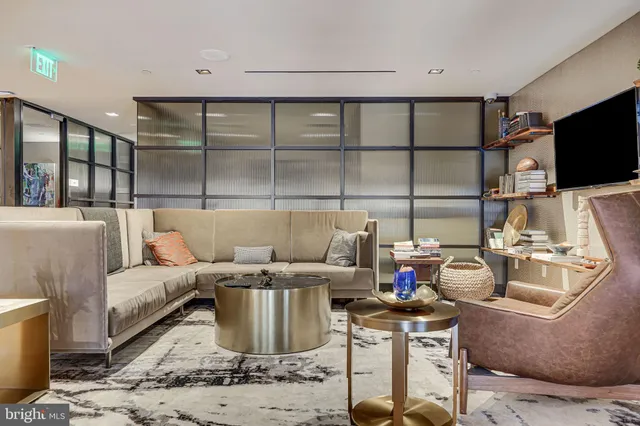 a view of a swimming pool with outdoor seating