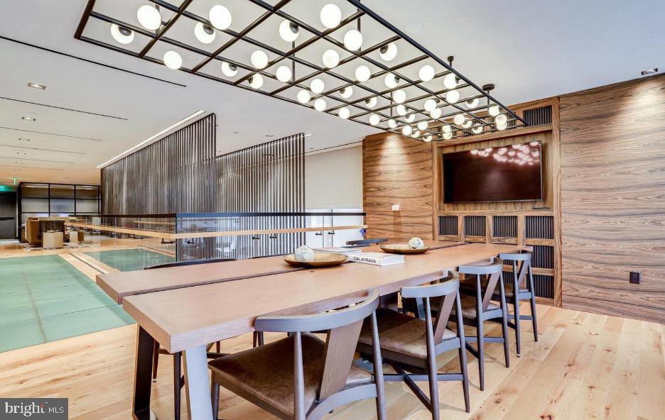 70 N Street Southeast, Unit N913 Washington, DC 20003 - Photo 41 of 77 a outdoor dining space with furniture and a flat screen tv