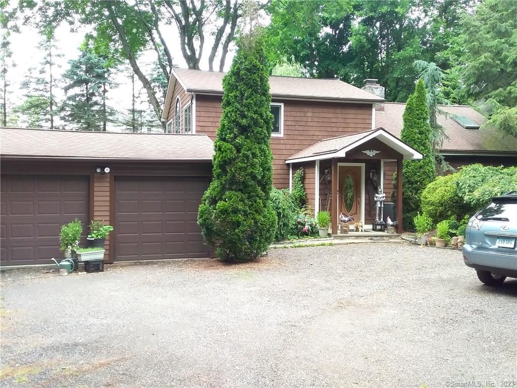 34 Old Tannery Road Monroe, CT 06468 - Photo 1 of 1 a front view of a house with a yard and garage