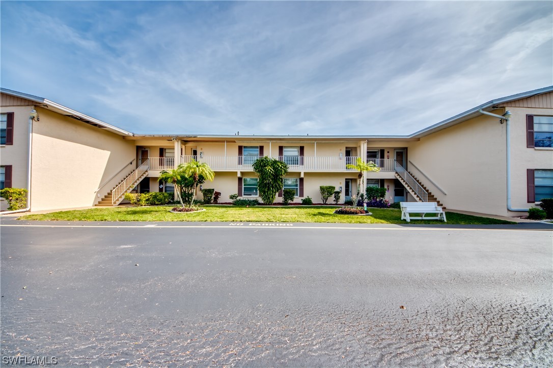 1100 Pondella Road, Unit 814 Cape Coral, FL 33909 - Photo 1 of 36 a view of a swimming pool with a yard