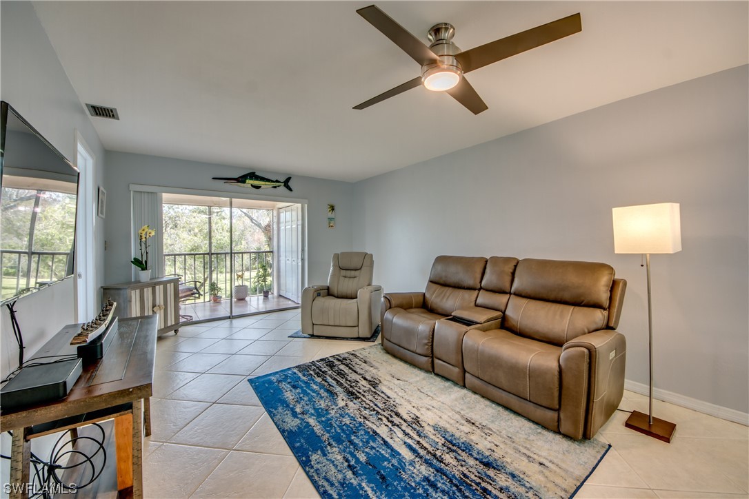 1100 Pondella Road, Unit 814 Cape Coral, FL 33909 - Photo 12 of 36 a living room with furniture and a window