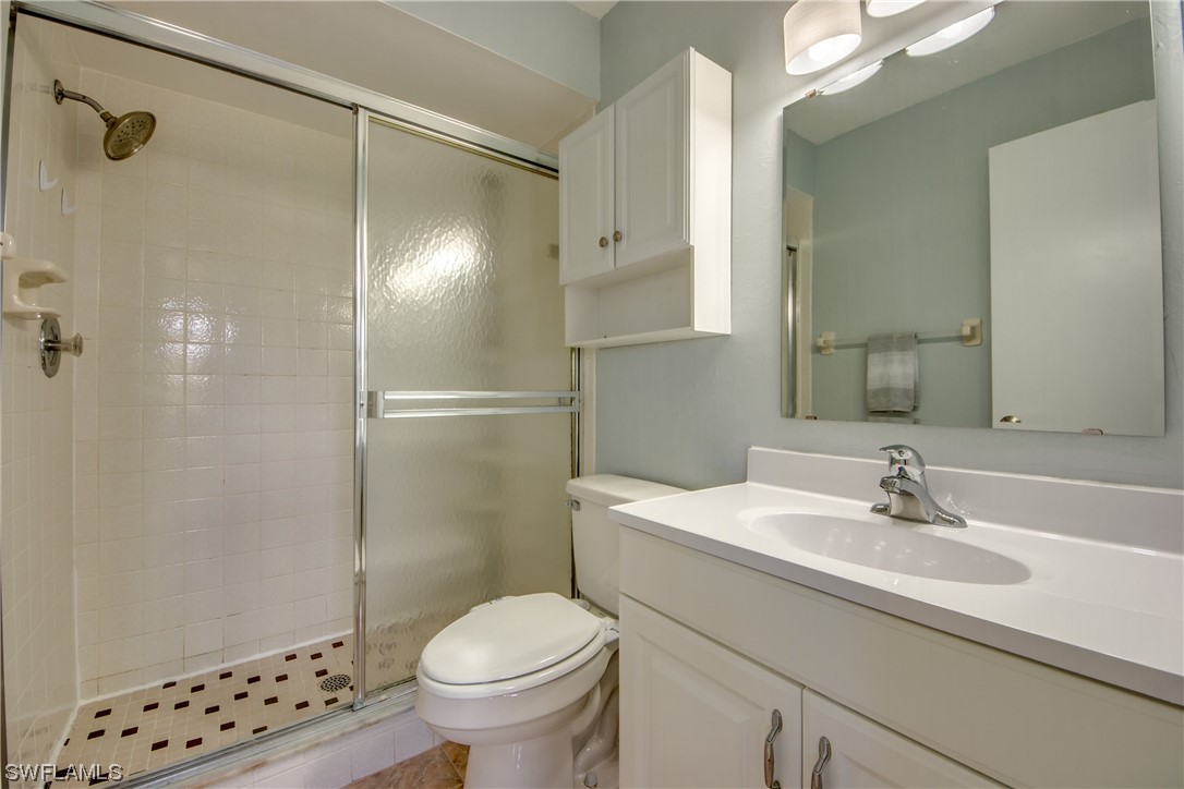 1100 Pondella Road, Unit 814 Cape Coral, FL 33909 - Photo 18 of 36 a bathroom with a sink toilet and shower