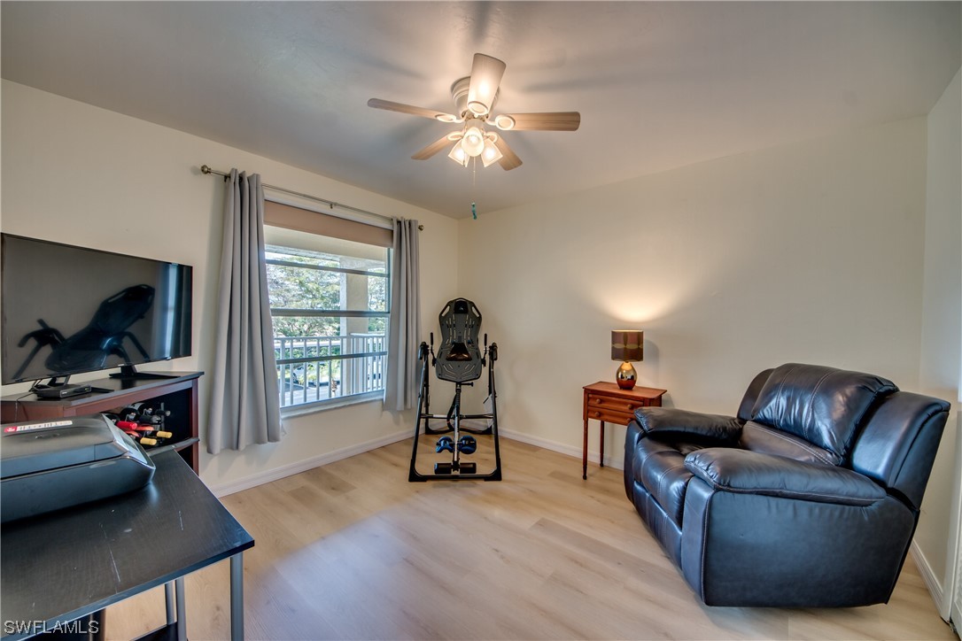 1100 Pondella Road, Unit 814 Cape Coral, FL 33909 - Photo 20 of 36 a living room with furniture and a flat screen tv