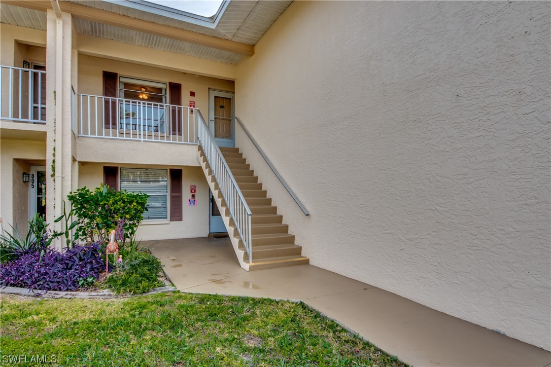 1100 Pondella Road, Unit 814 Cape Coral, FL 33909 - Photo 2 of 36 a front view of a house with a yard