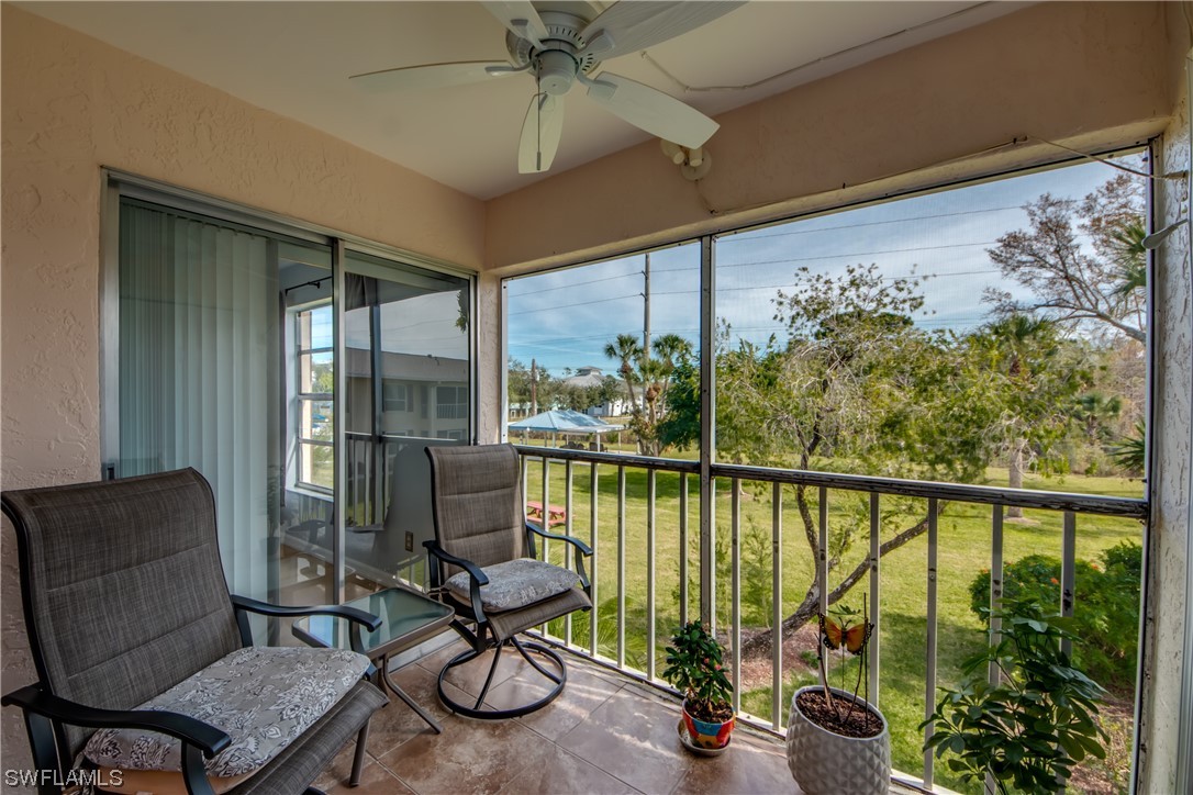 1100 Pondella Road, Unit 814 Cape Coral, FL 33909 - Photo 24 of 36 a view of a balcony with furniture