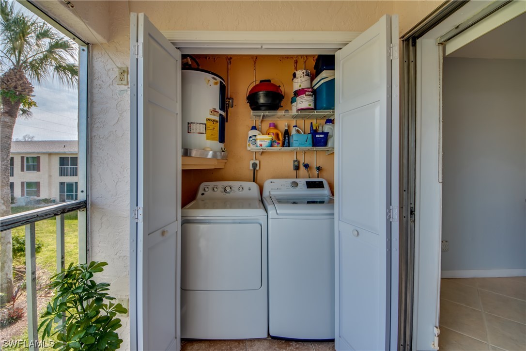 1100 Pondella Road, Unit 814 Cape Coral, FL 33909 - Photo 25 of 36 a utility room with dryer and washer