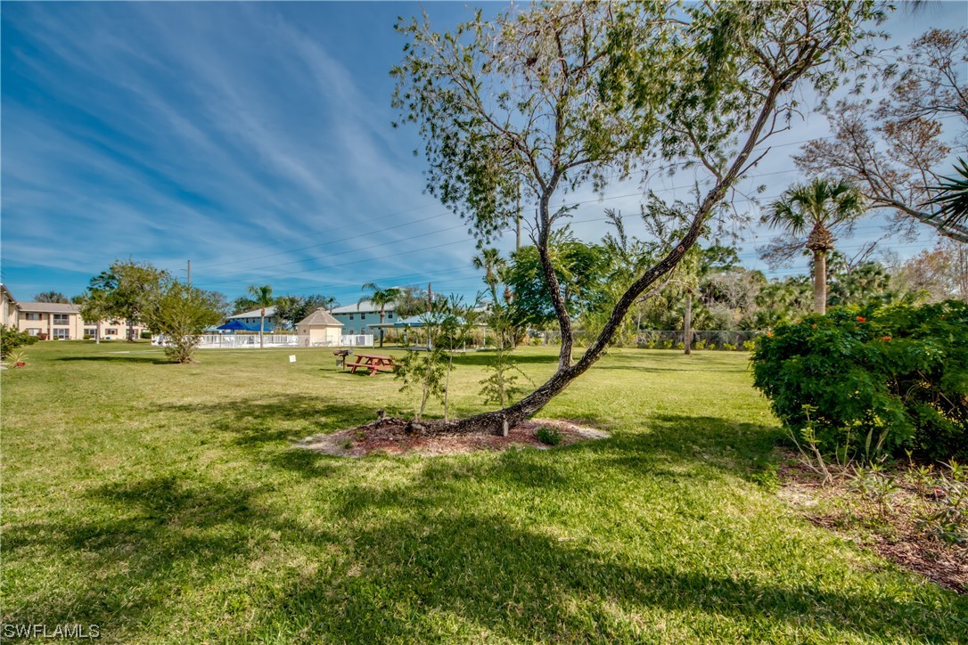 1100 Pondella Road, Unit 814 Cape Coral, FL 33909 - Photo 26 of 36 a view of swimming pool with a yard