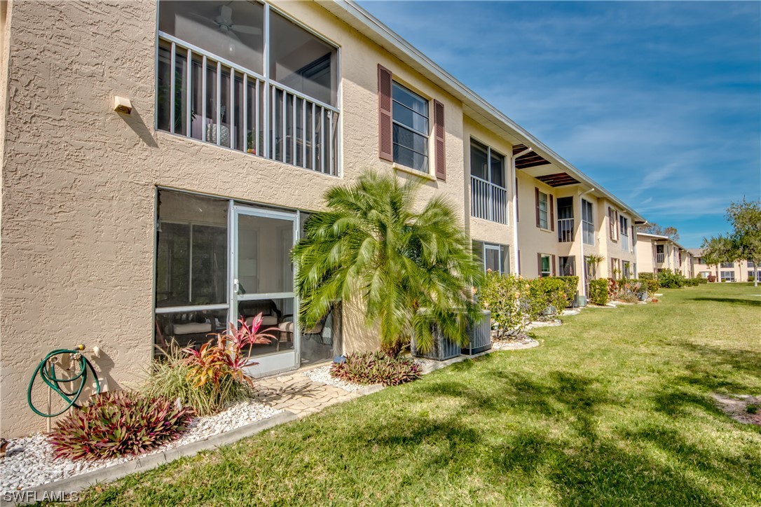 1100 Pondella Road, Unit 814 Cape Coral, FL 33909 - Photo 28 of 36 a view of a house with backyard and sitting area