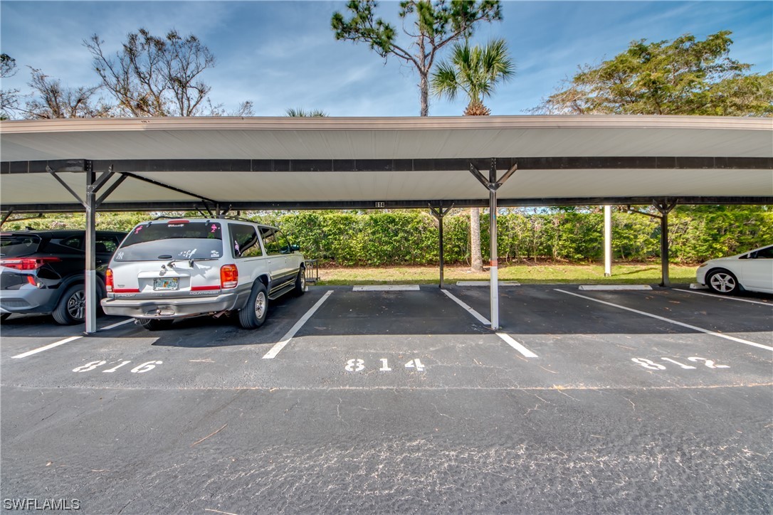 1100 Pondella Road, Unit 814 Cape Coral, FL 33909 - Photo 32 of 36 a white car parked in a parking