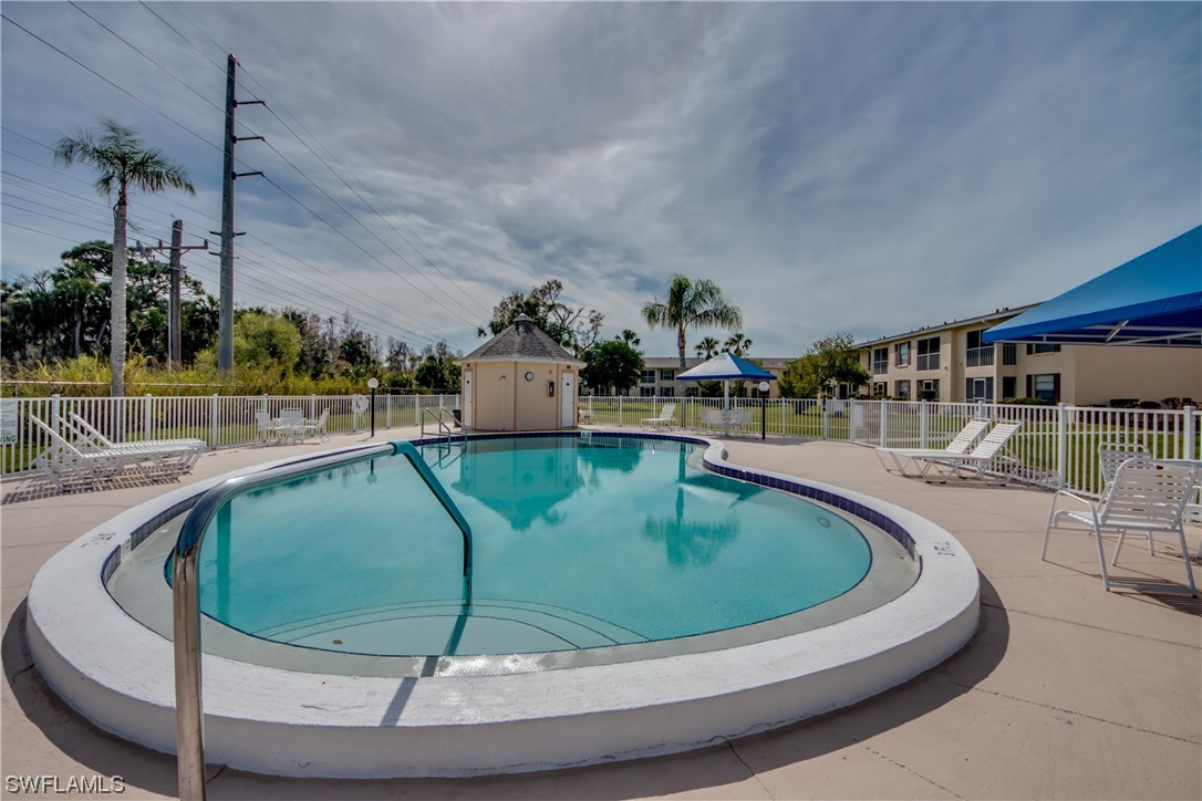 1100 Pondella Road, Unit 814 Cape Coral, FL 33909 - Photo 36 of 36 a view of a swimming pool with outdoor seating