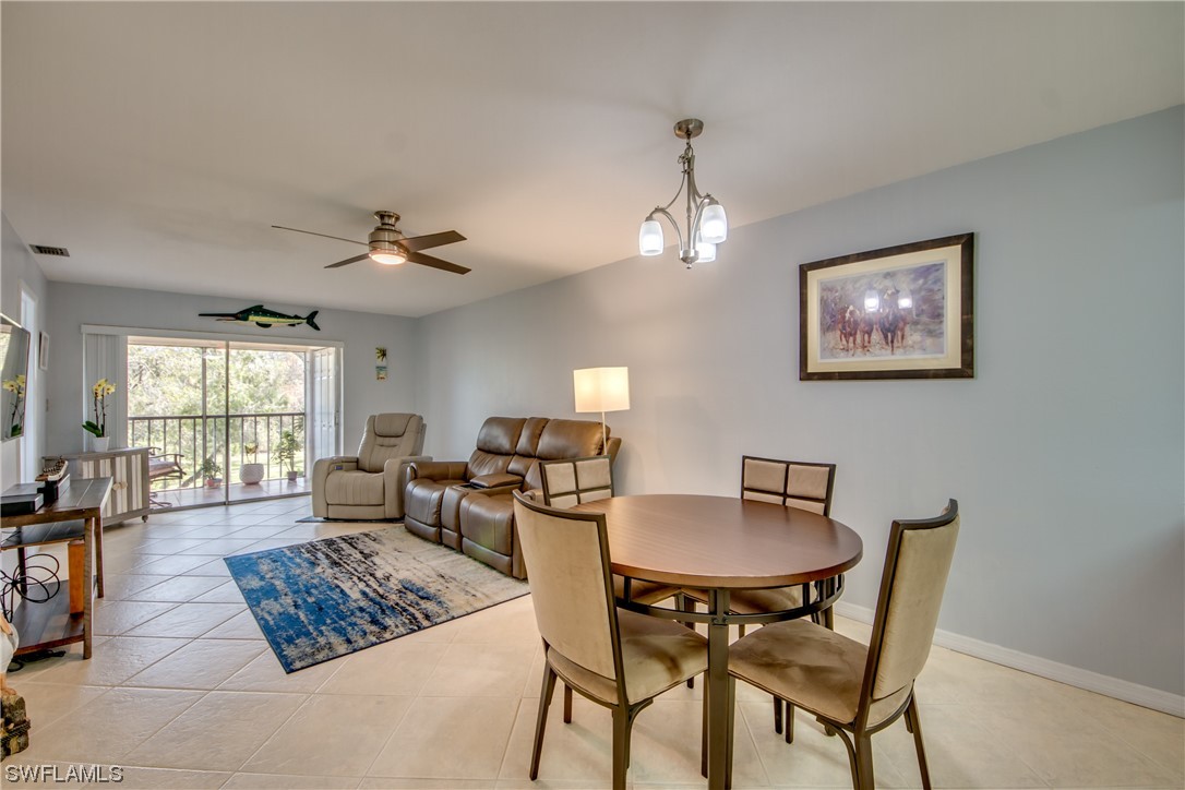 1100 Pondella Road, Unit 814 Cape Coral, FL 33909 - Photo 9 of 36 a living room with furniture and a table